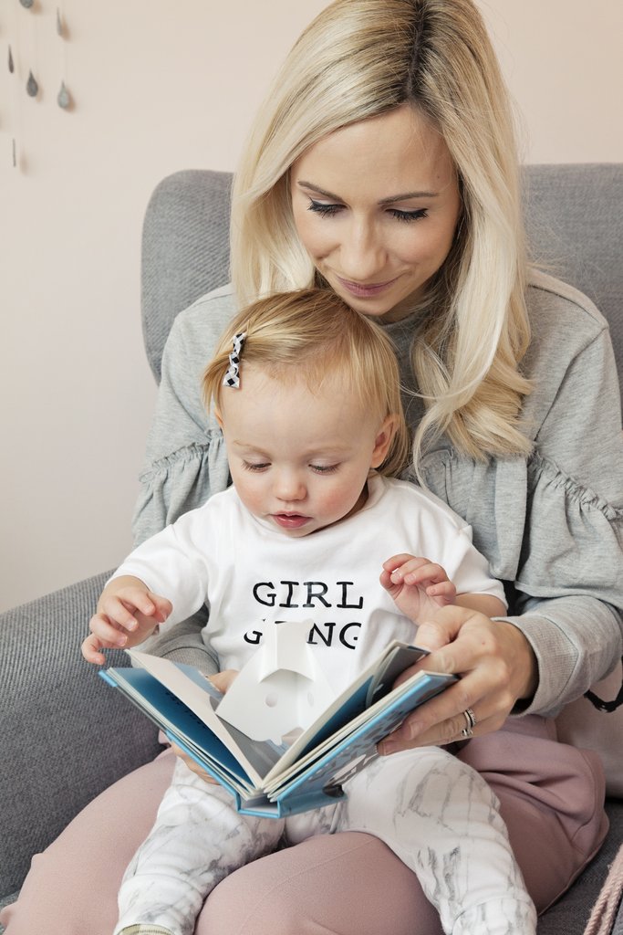 Reading in Alba's nursery